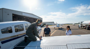 Student pilot inspecting aircraft during training, showing student pilot life